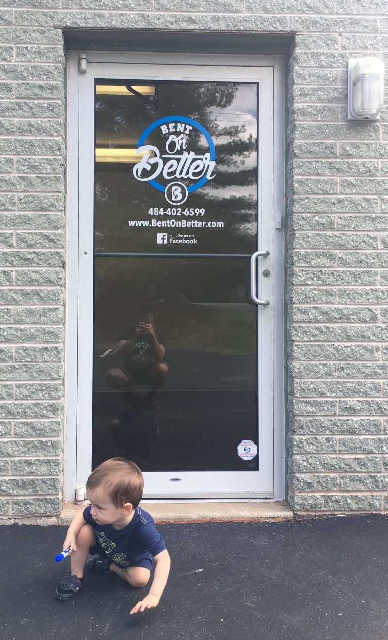 This is Joey, sitting outside of our front door proudly as if he drew the blue circle on it, but he didn't<br /> &#x1f61c; (that's too high for him to reach)