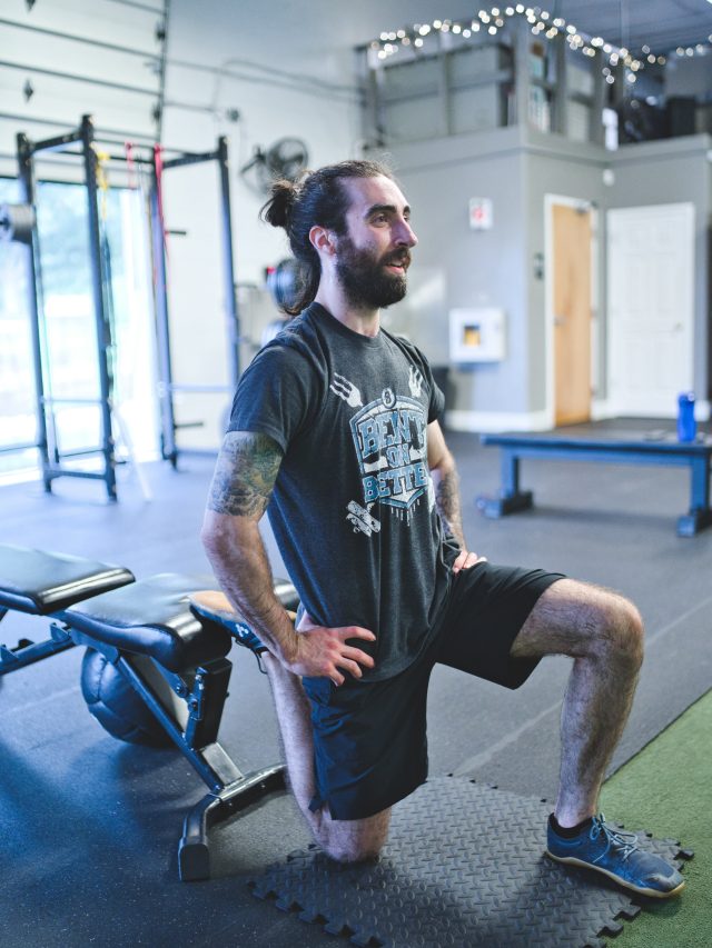 a man doing lunges at a gym