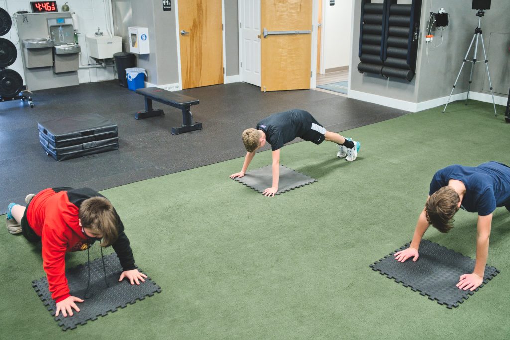 Young boys working put in a gym